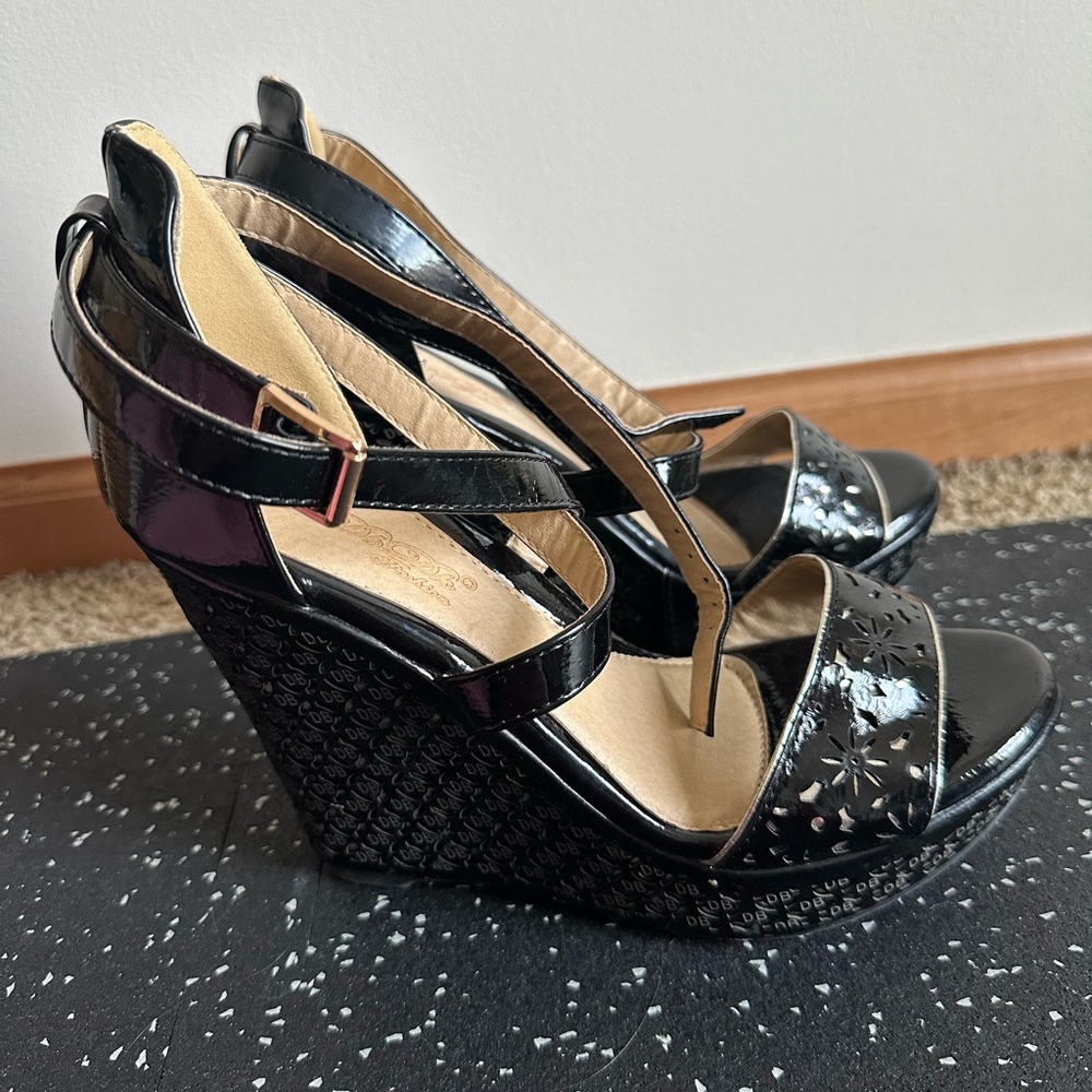 Black wedge sandals. Never worn.